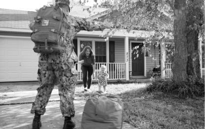 Soldier returning home to spouse and child